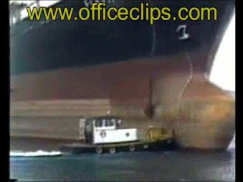 Ship Drops Anchor on Tug Boat